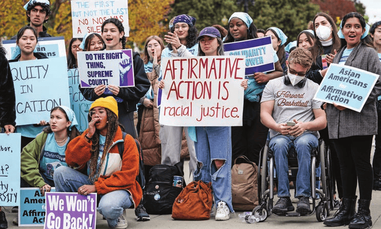 October 2022: Liberal activists protest outside Supreme Court
        during oral arguments in cases that ended affirmative action in college
        admissions, Washington, D.C.