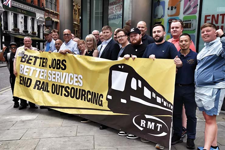 RMT banner: 'Better jobs, better services, end rail outsourcing'