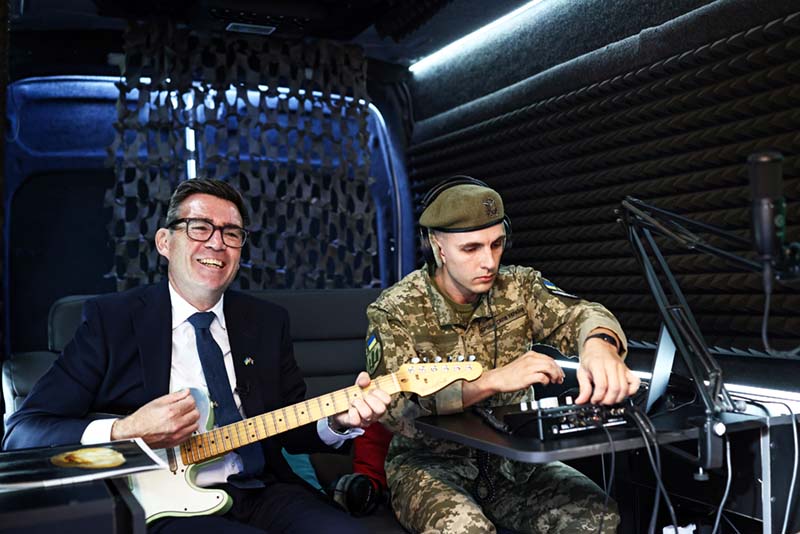 Andy Burnham playing the guitar in Ukraine, August 2026